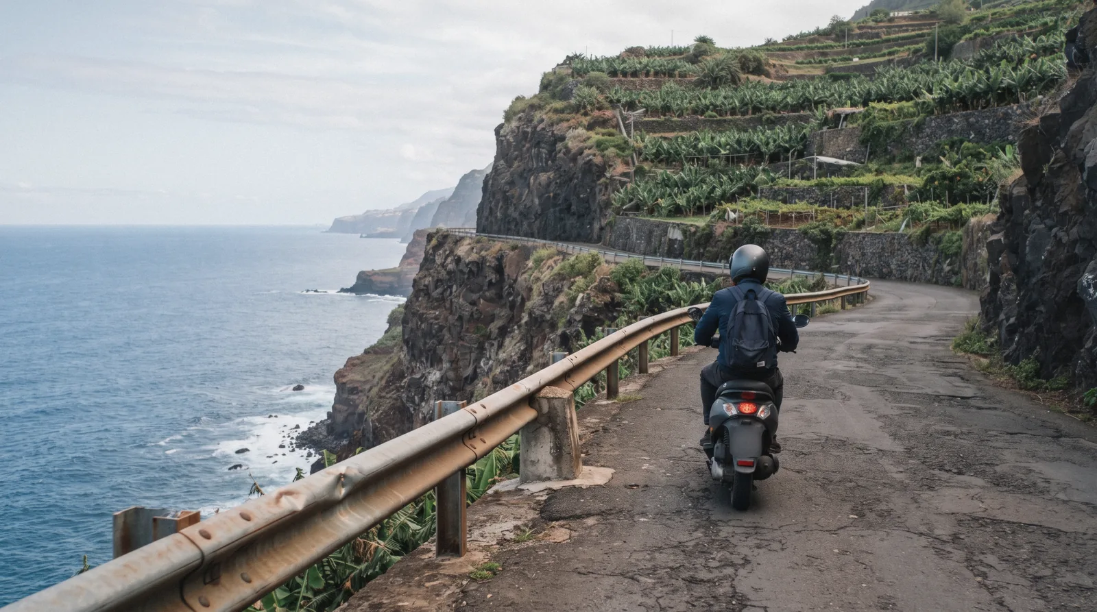A scooter and bicycles parked on a Madeira street, ready for scooter rental and bike hire in Madeira, Portugal