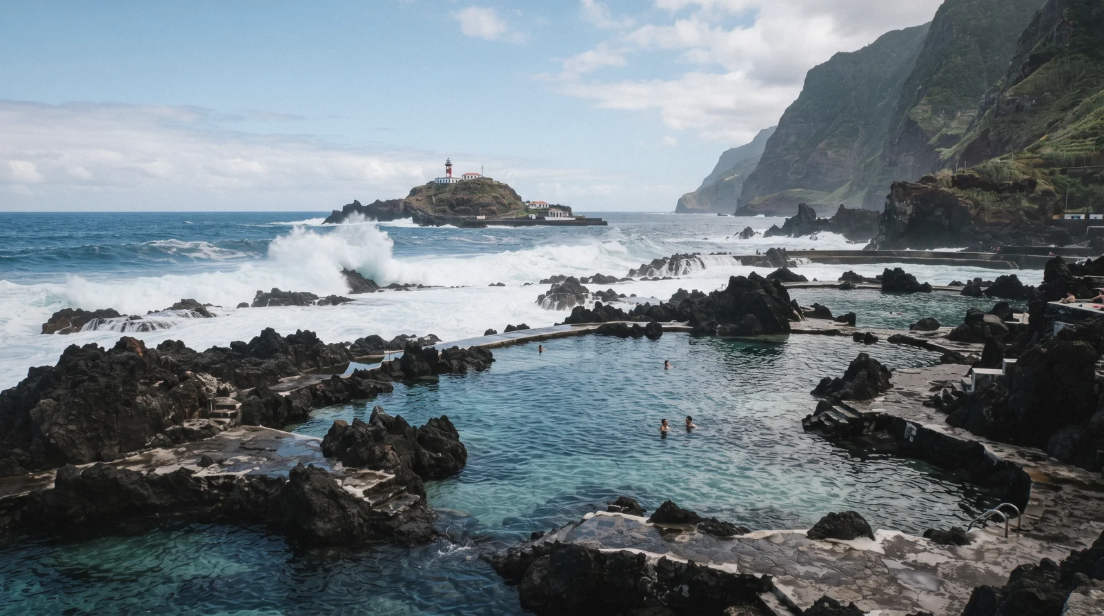Volcanic rock pools at Porto Moniz filled with clear seawater beside the Atlantic, Madeira, Portugal