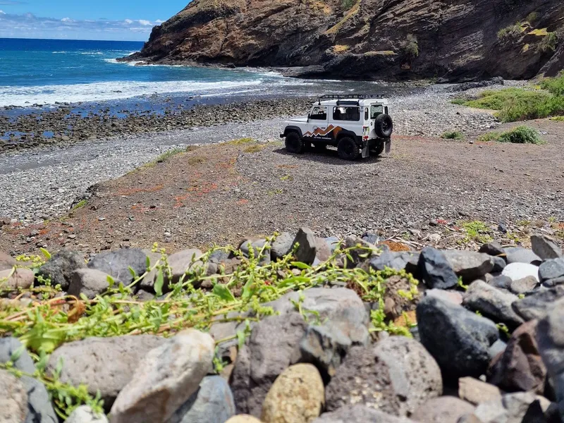 A 4x4 vehicle parked above the golden-sand beach of Porto Santo on a Porto Santo Island Highlights 4x4 tour in Porto Santo, Madeira