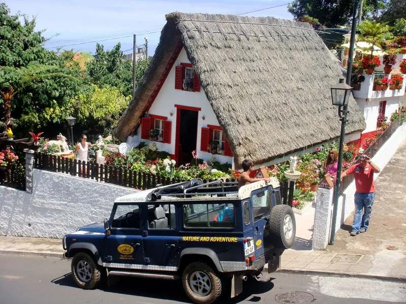 A jeep convoy parked at a mountain viewpoint on a Madeira full-day jeep tour with lunch in central Madeira, Portugal